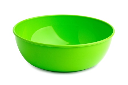 Beautiful bright green plastic plate on a white backgroundの写真素材