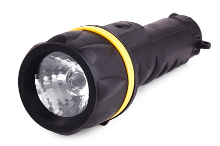 Black plastic flashlight with a yellow rim on a white backgroundの写真素材