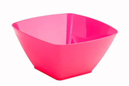 An empty pink plastic plate on a white backgroundの写真素材