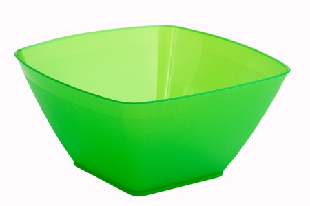 An empty green plastic plate on a white backgroundの写真素材