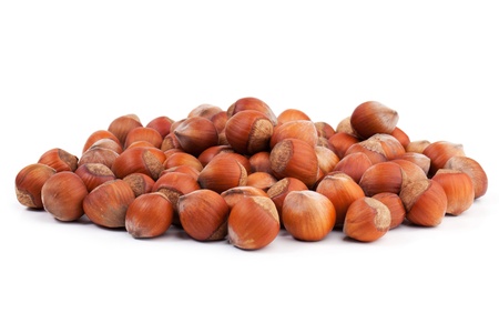 A lot of ripe hazel-nuts on white backgroundの写真素材