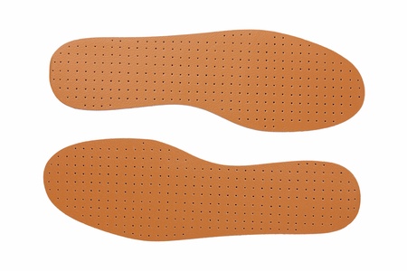 Brown leather shoe insoles on a white backgroundの写真素材