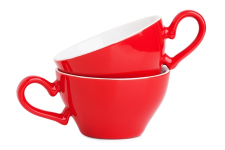 Two elegant red coffee cups on a white backgroundの写真素材