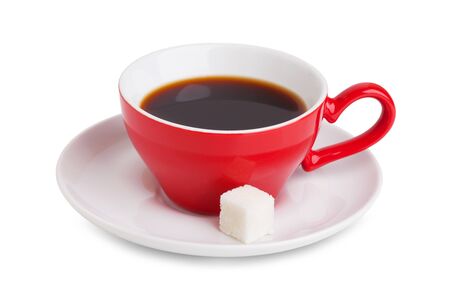 Red cup of coffee and a slice of white sugar on a saucer on a white backgroundの写真素材