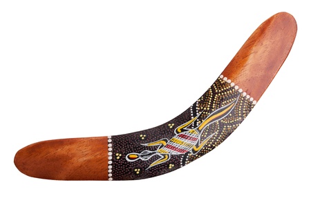 Wooden boomerang with painted lizard on white backgroundの写真素材