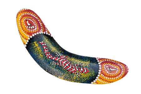 This boomerang is decorated with a lizard pattern on a white backgroundの写真素材