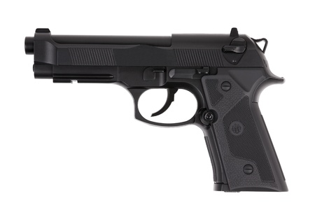 Black metal pistol with the trigger on a white backgroundの写真素材