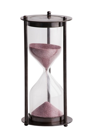 Hourglass with the sand in a brass case on white backgroundの写真素材