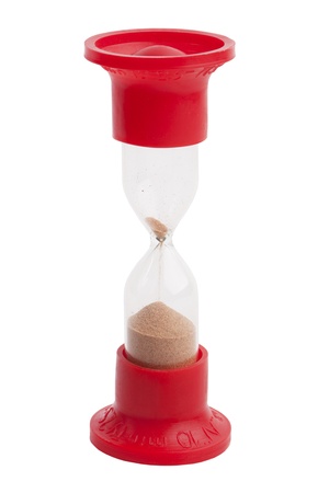 Hourglass with the remnants of sand on a white backgroundの写真素材