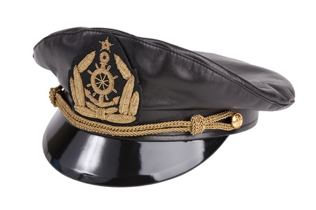 Black navy cap with the golden emblem of an anchor on a white backgroundの写真素材