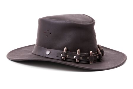 The brown suede cowboy hat with bullets on a white backgroundの写真素材