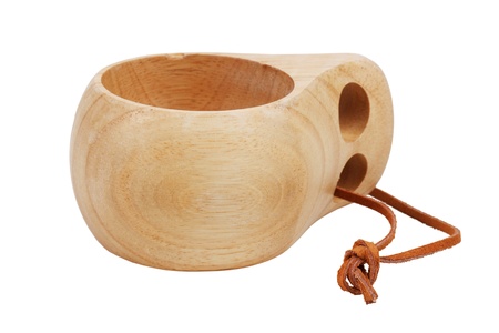 Cup, carved from wood with a leather strap on  white backgroundの写真素材