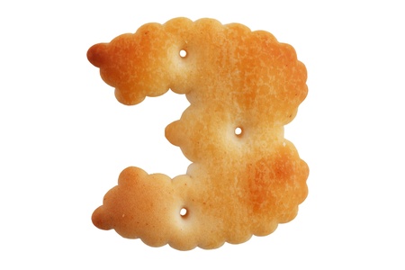 Cookies crackers in a figure three on white backgroundの写真素材