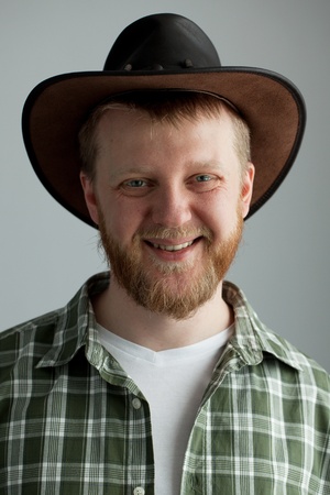 The good-natured cowboy hat and a green plaid shirtの写真素材
