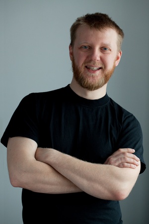Cheerful red-bearded smiling guy in the black t-shirt Cheerful red-bearded smiling guy in the black t-shirt