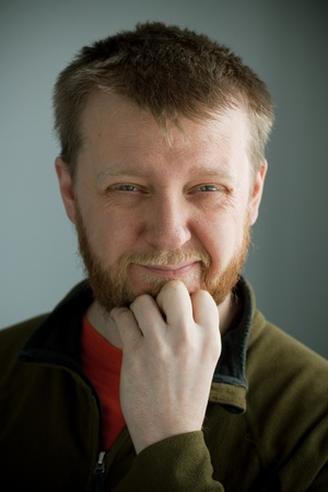 Bearded man with a thoughtful expression on his faceの写真素材