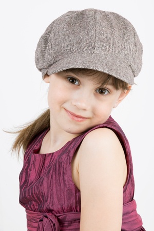 The little fashionista in cap and gown on a light backgroundの写真素材