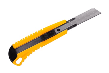 The yellow stationery knife on a white backgroundの写真素材