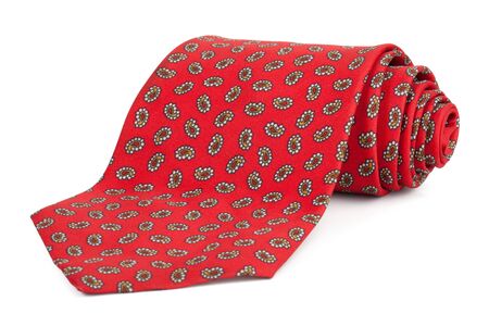 Rolled red tie on a white backgroundの写真素材
