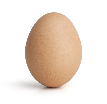 Standing an egg upright on a gray backgroundの写真素材