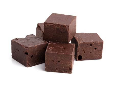 Pieces of dark chocolate on a white backgroundの写真素材