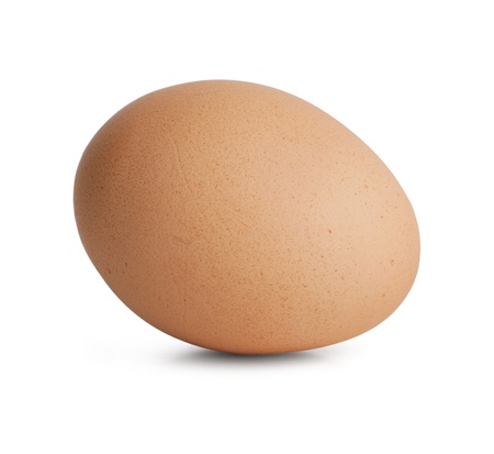 Beige raw egg on a white backgroundの写真素材