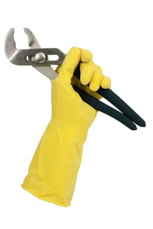 Gloved hand holding clamp on a white backgroundの写真素材