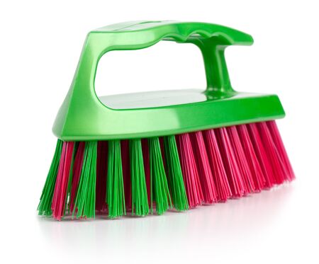 Brush for cleaning with a plastic handle on  white backgroundの写真素材