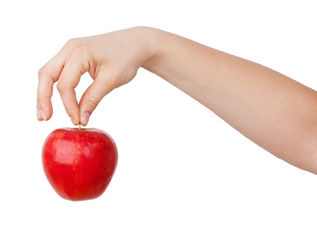 Ripe red apple in his hand on a white backgroundの写真素材