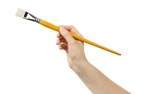 Brush drawing in hand on white backgroundの写真素材