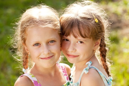 Two funny girlfriend with pigtails in the summerの写真素材