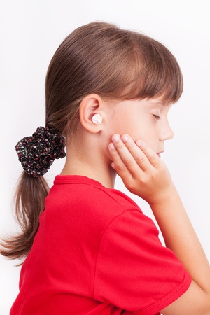 Girl with ear plugs in your ears with your eyes closedの写真素材