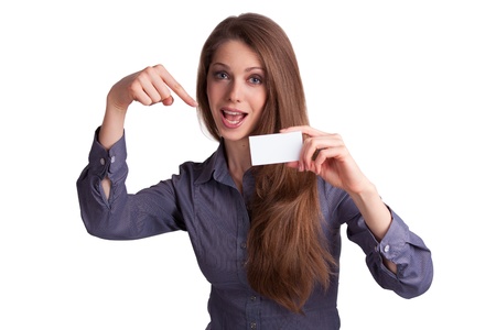 Pretty young girl shows a business cardの写真素材