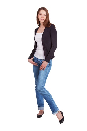 Long-haired girl in jeans and a dark sweaterの写真素材