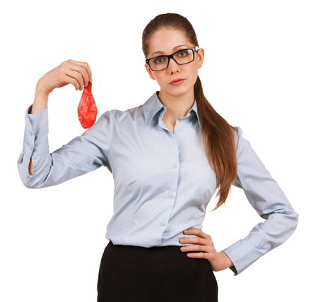 Sad young business woman holding a deflated balloonの写真素材