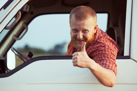 Bearded driver shows that all is wellの写真素材