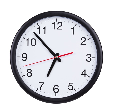 Round office clock shows almost seven oの写真素材