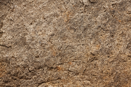 Surface of the stone gray-brown with many irregularitiesの写真素材