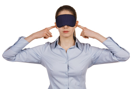 Young woman with a blindfold on white backgroundの写真素材
