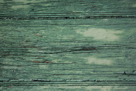 Old wooden surface painted with green paintの写真素材