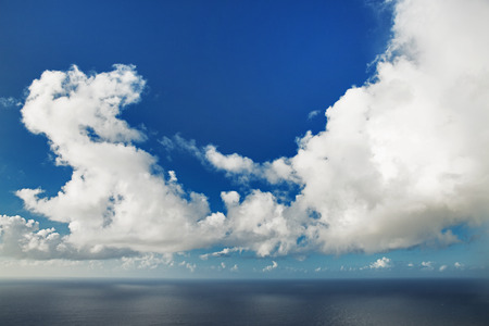 Huge cumulus cloud hovering over ocean surfaceの写真素材