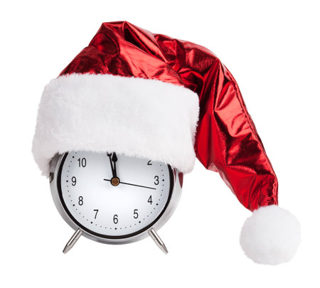 Santaklaus cap on a round metal alarm clockの写真素材