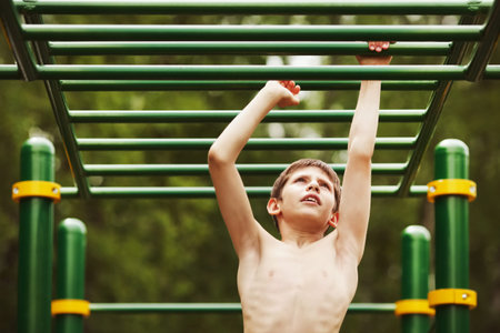 Teen exercise on the playground in summer