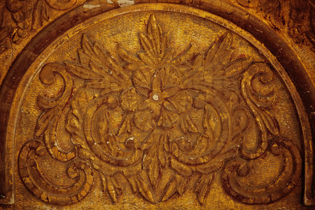 Ancient relief pattern of gilded wood in the cracksの写真素材