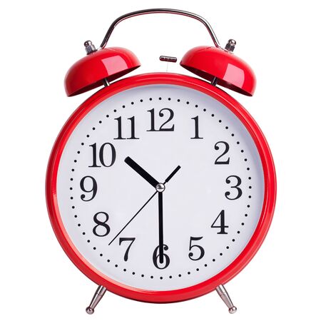 Red round alarm clock shows half past tenの写真素材