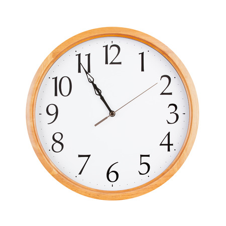 Five minutes to eleven on round clockの写真素材