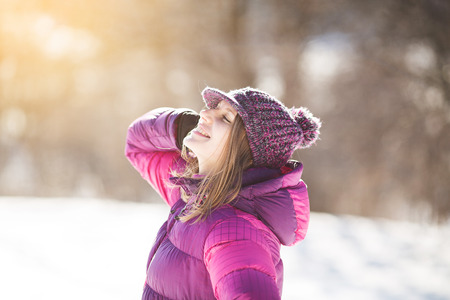 Beautiful happy girl in a hat in the sunの写真素材