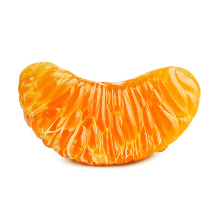 Juicy slice of ripe tangerine on a white backgroundの写真素材