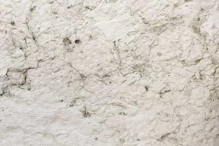 Background in the form of a white plastered wallの写真素材