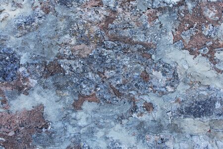 Rough rocky surface in gray and brownの写真素材